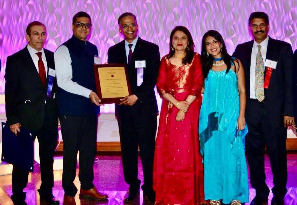 DCG Vishal Harsh presenting the award to Nitin Mhatre, Chief Executive Officer at First County Bank